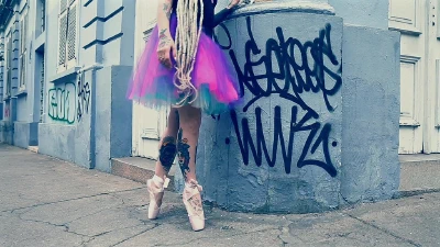 Cover for 'Ballerina Wearing Ballet Shoes And Walking Down The Street'